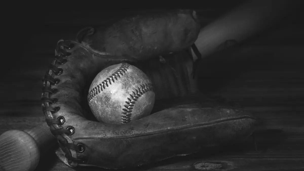 Photograph of an old baseball, glove, and bat