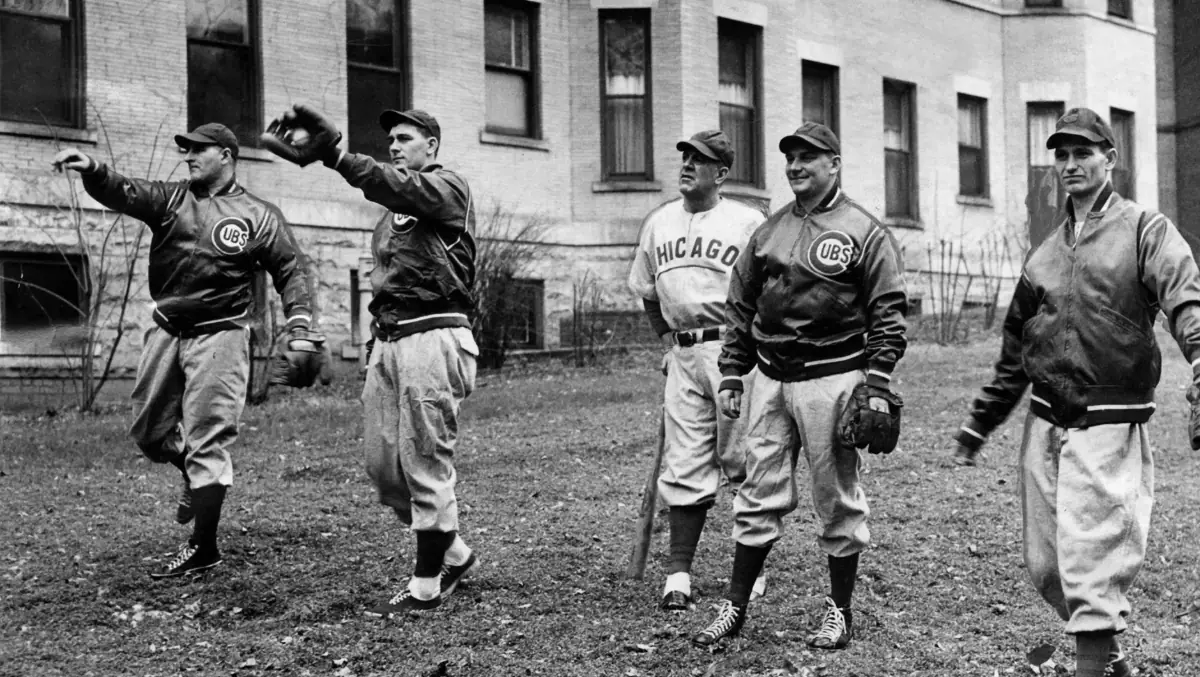 Chicago Cubs pitchers, including Ed Hanyzewski, warm up during a practice.